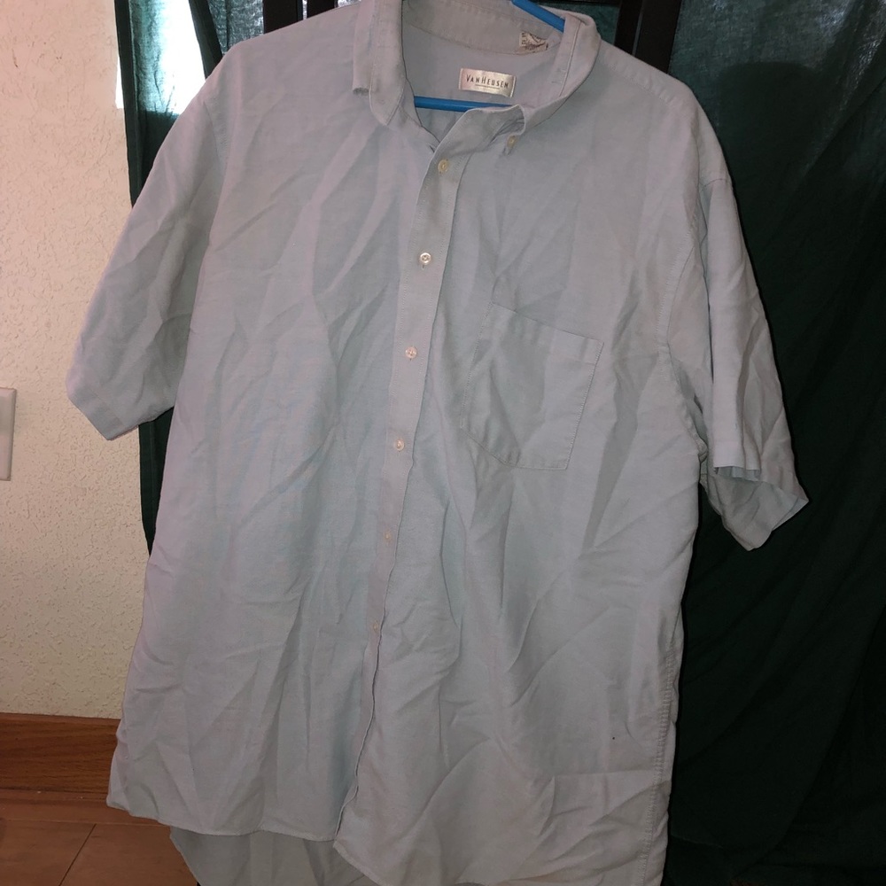 A men’s blue button up tee shirt